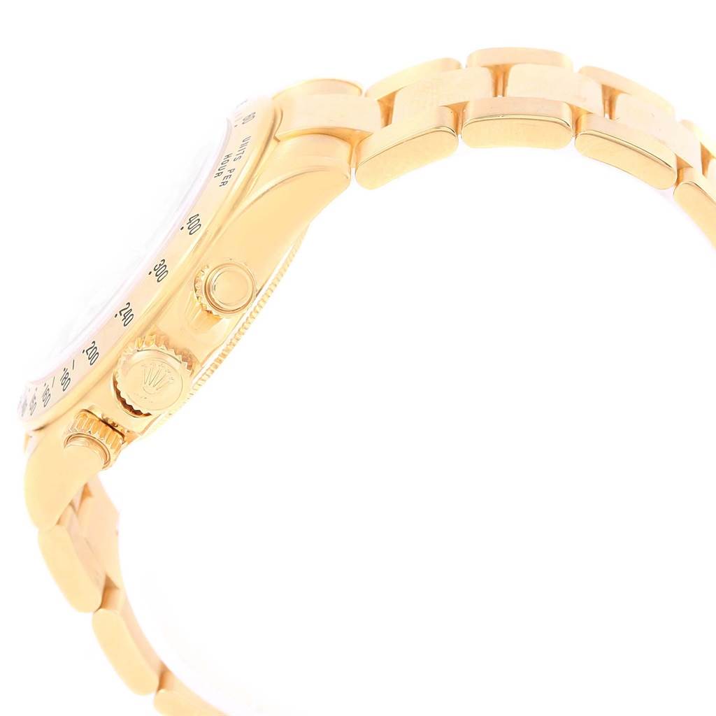 This image shows a side profile angle of a Rolex Daytona 116528 Men's Yellow Gold Black Dial 116528 Men's Yellow Gold Black Dial watch, displaying the crown, pushers, and part of the bracelet.