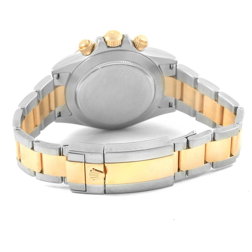 The image shows the back view and bracelet of the Rolex Daytona 116523 Men's Steel and Gold (two tone) White Dial 116523 Men's Steel and Gold (two tone) White Dial watch, highlighting the clasp and crown.
