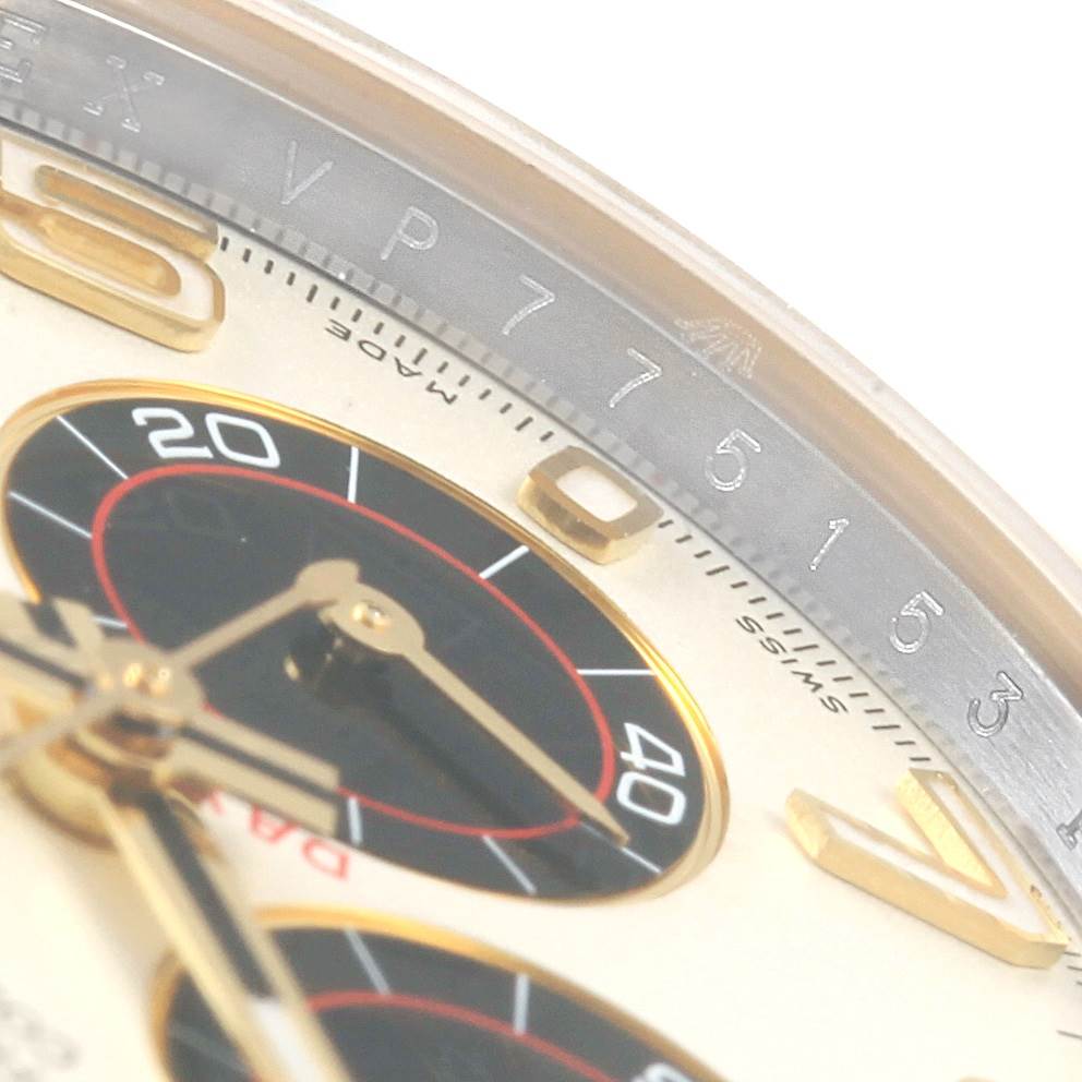 This close-up image shows the chronograph sub-dials and the bezel of a Rolex Daytona 116523 Men's Steel and Gold (two tone) White Dial 116523 Men's Steel and Gold (two tone) White Dial watch.