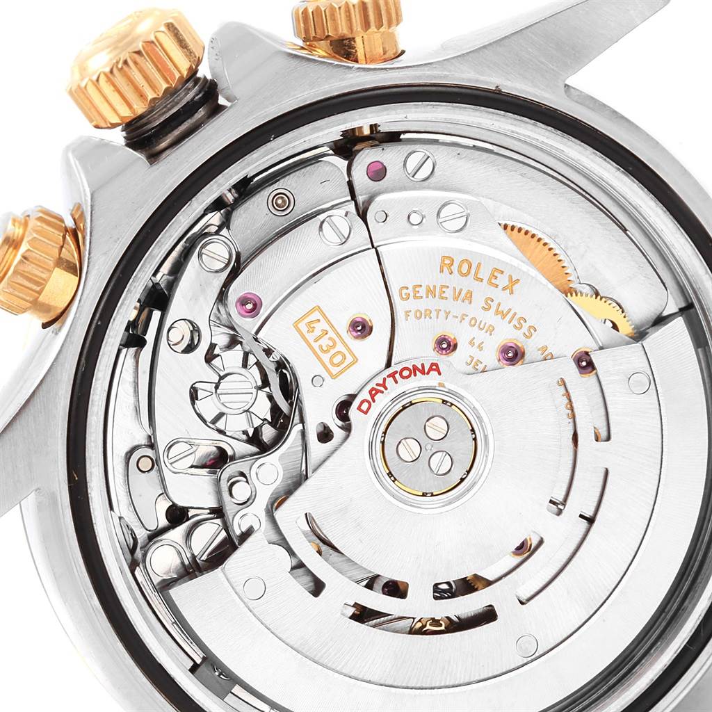 The image shows the Rolex Daytona 116523 Men's Steel and Gold (two tone) White Dial 116523 Men's Steel and Gold (two tone) White Dial watch's internal mechanism, focusing on the movement and rotor.