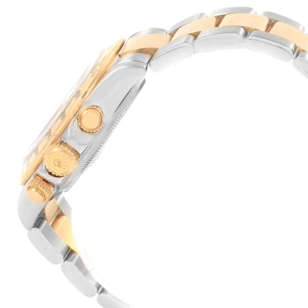 Side view of the Rolex Daytona 116523 Men's Steel and Gold (two tone) Grey Dial 116523 Men's Steel and Gold (two tone) Grey Dial watch showing the crown and push buttons, as well as part of the metal bracelet.