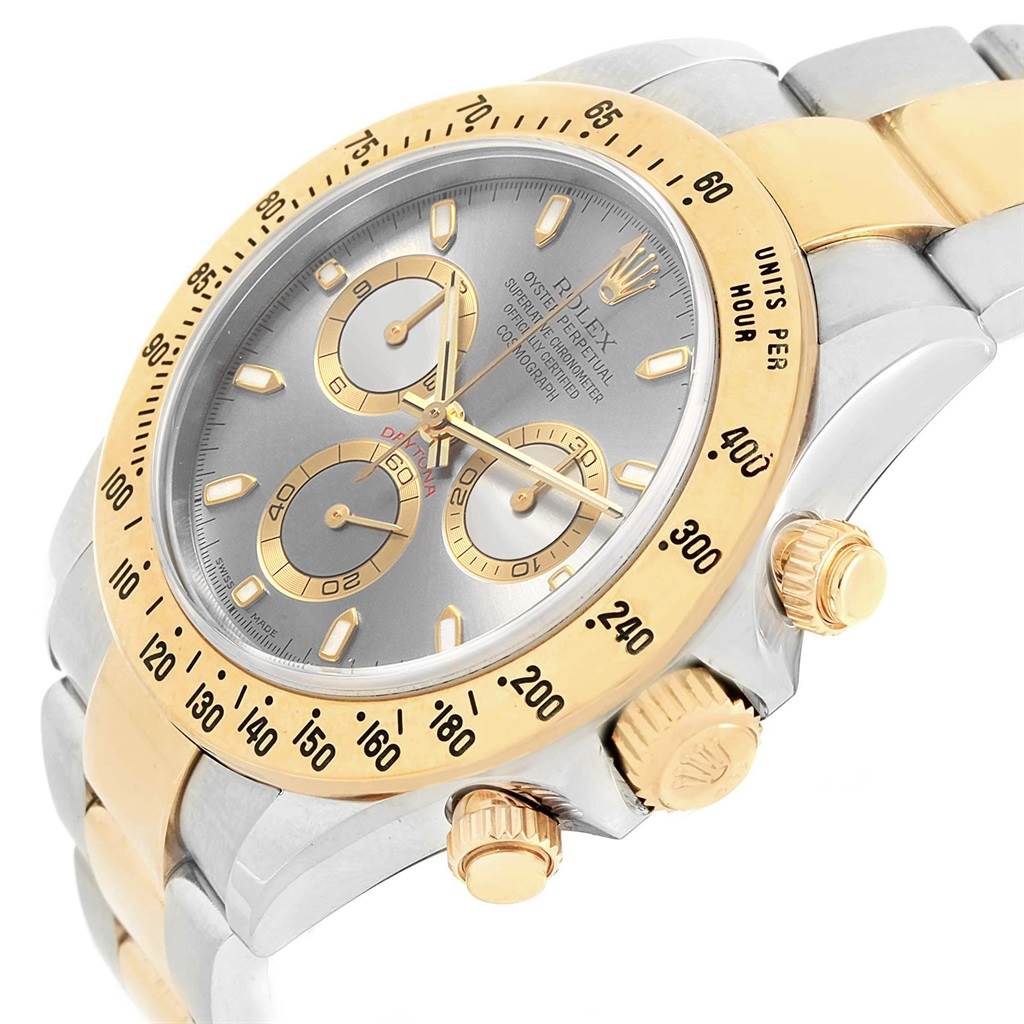 This image shows a close-up angle of the Rolex Daytona 116523 Men's Steel and Gold (two tone) Grey Dial 116523 Men's Steel and Gold (two tone) Grey Dial watch, highlighting the dial, bezel, and crown.