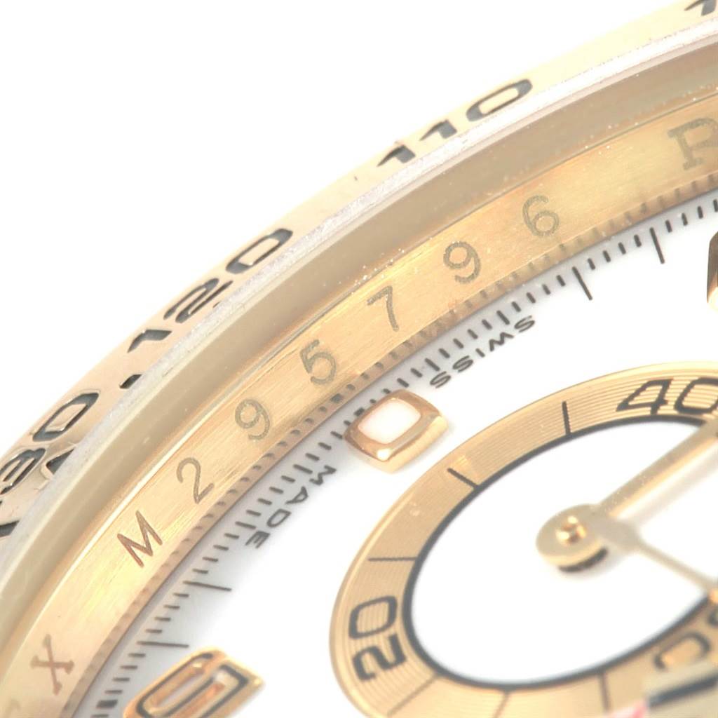 This close-up image of a Rolex Daytona 116518 Men's Yellow Gold White Dial 116518 Men's Yellow Gold White Dial model watch shows the chronograph sub-dial and part of the tachymeter bezel.
