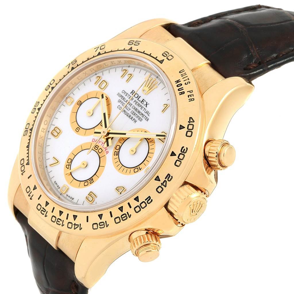 The Rolex Daytona 116518 Men's Yellow Gold White Dial 116518 Men's Yellow Gold White Dial watch is shown at a slight angle, revealing the dial, bezel, crown, and a portion of the strap.