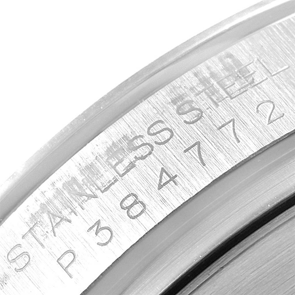 This image shows the engraved serial and material details on the case back of the Rolex Daytona 116520 Men's Stainless Steel White Dial 116520 Men's Stainless Steel White Dial watch.