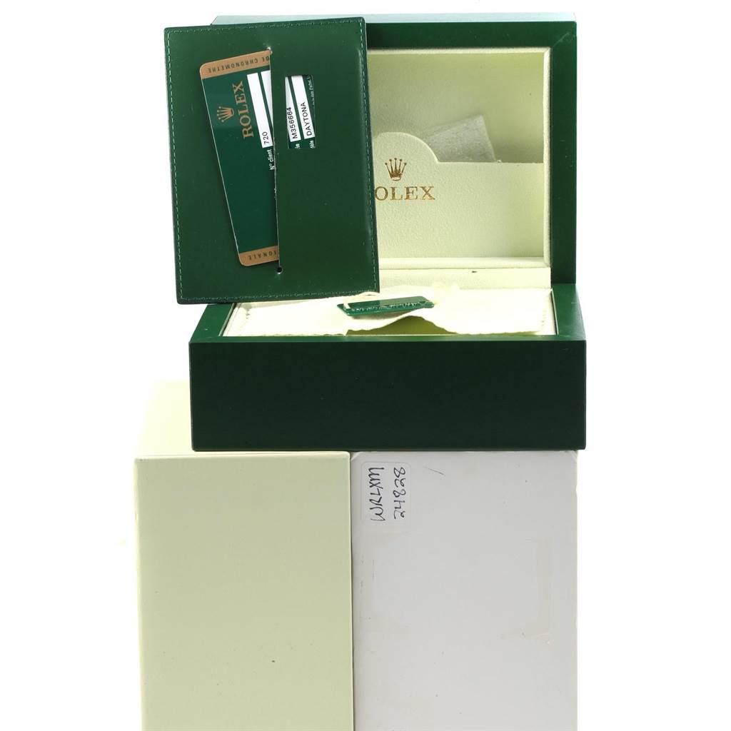 The image displays the open box and authentication cards for a Rolex Daytona 116520 Men's Stainless Steel Black Dial 116520 Men's Stainless Steel Black Dial watch.