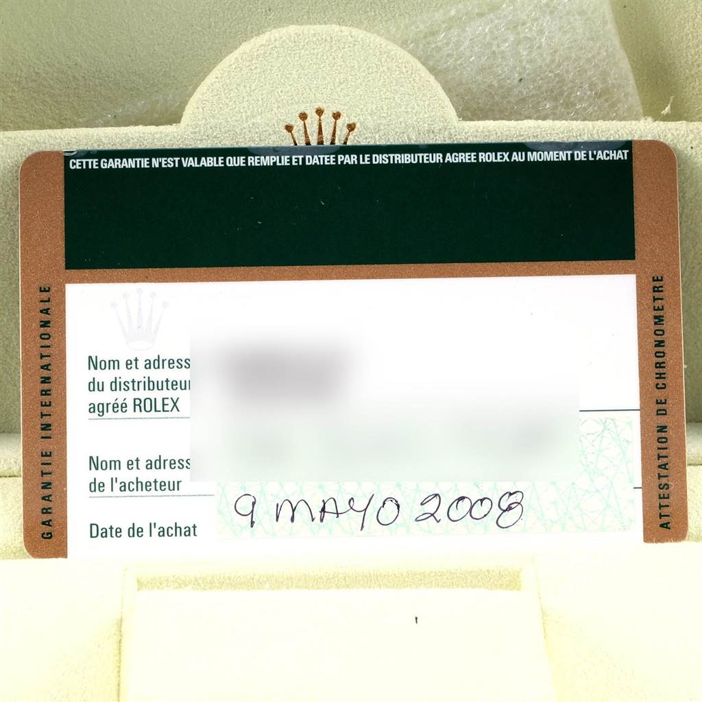 This image shows a warranty card for a Rolex Daytona 116520 Men's Stainless Steel Black Dial 116520 Men's Stainless Steel Black Dial watch, including the purchase date and dealer information.
