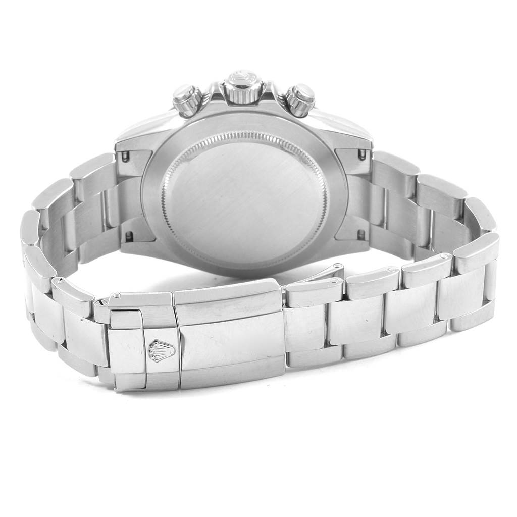 The image shows the back case, crown, pushers, and bracelet of a Rolex Daytona 116520 Men's Stainless Steel Black Dial 116520 Men's Stainless Steel Black Dial watch.