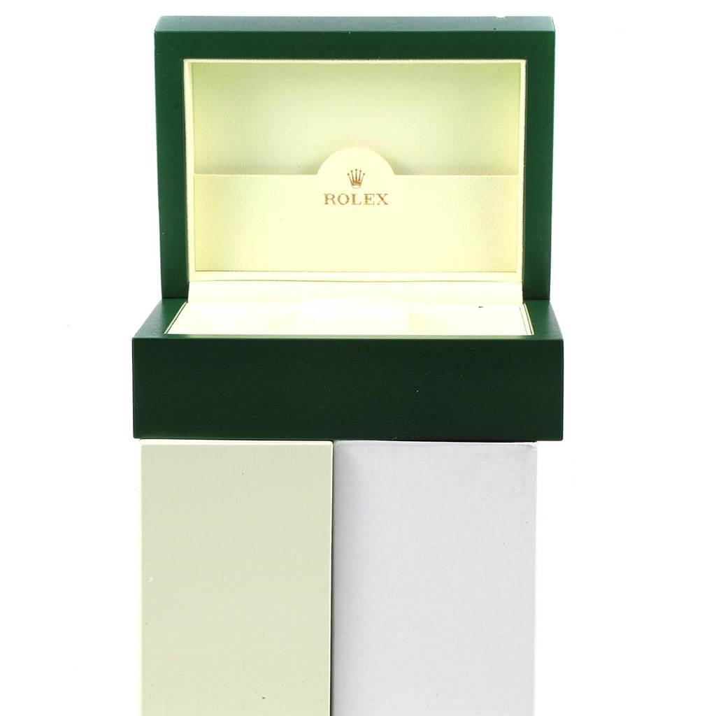 An open Rolex Daytona 116528 Men's Yellow Gold Champagne Dial 116528 Men's Yellow Gold Champagne Dial watch box is shown from the front, displaying the interior and the "Rolex" logo.