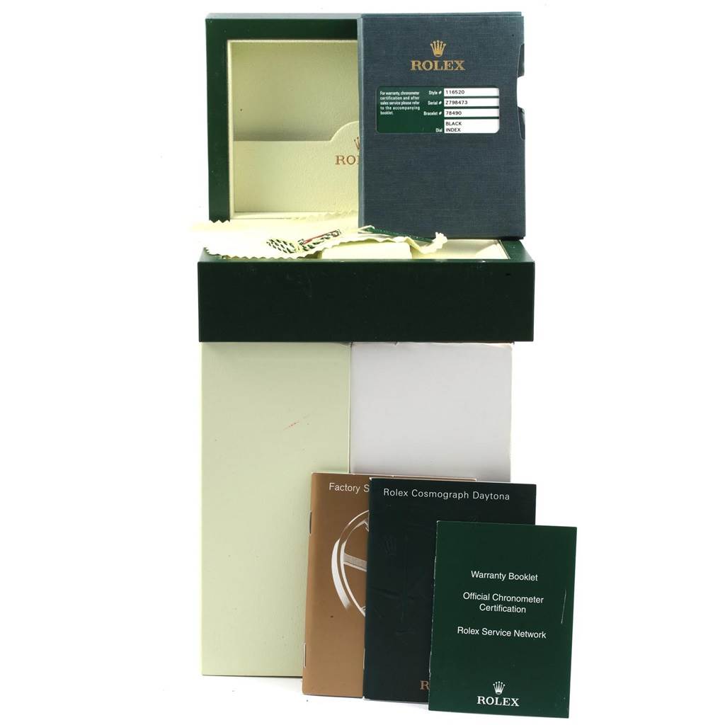 This image shows the packaging, warranty booklets, and documentation for a Rolex Daytona 116520 Men's Stainless Steel Black Dial 116520 Men's Stainless Steel Black Dial watch.
