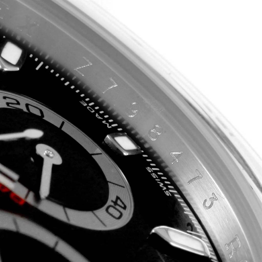 Close-up view of the dial and bezel of a Rolex Daytona 116520 Men's Stainless Steel Black Dial 116520 Men's Stainless Steel Black Dial watch, displaying part of the face and numbers.