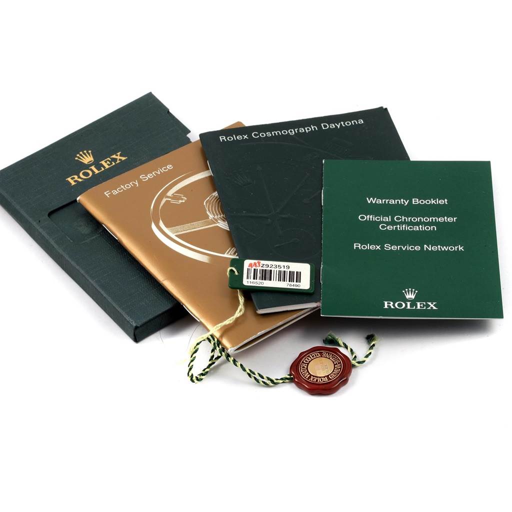 This image shows the warranty booklet, factory service booklet, and other documentation for a Rolex Daytona 116520 Men's Stainless Steel White Dial 116520 Men's Stainless Steel White Dial watch.