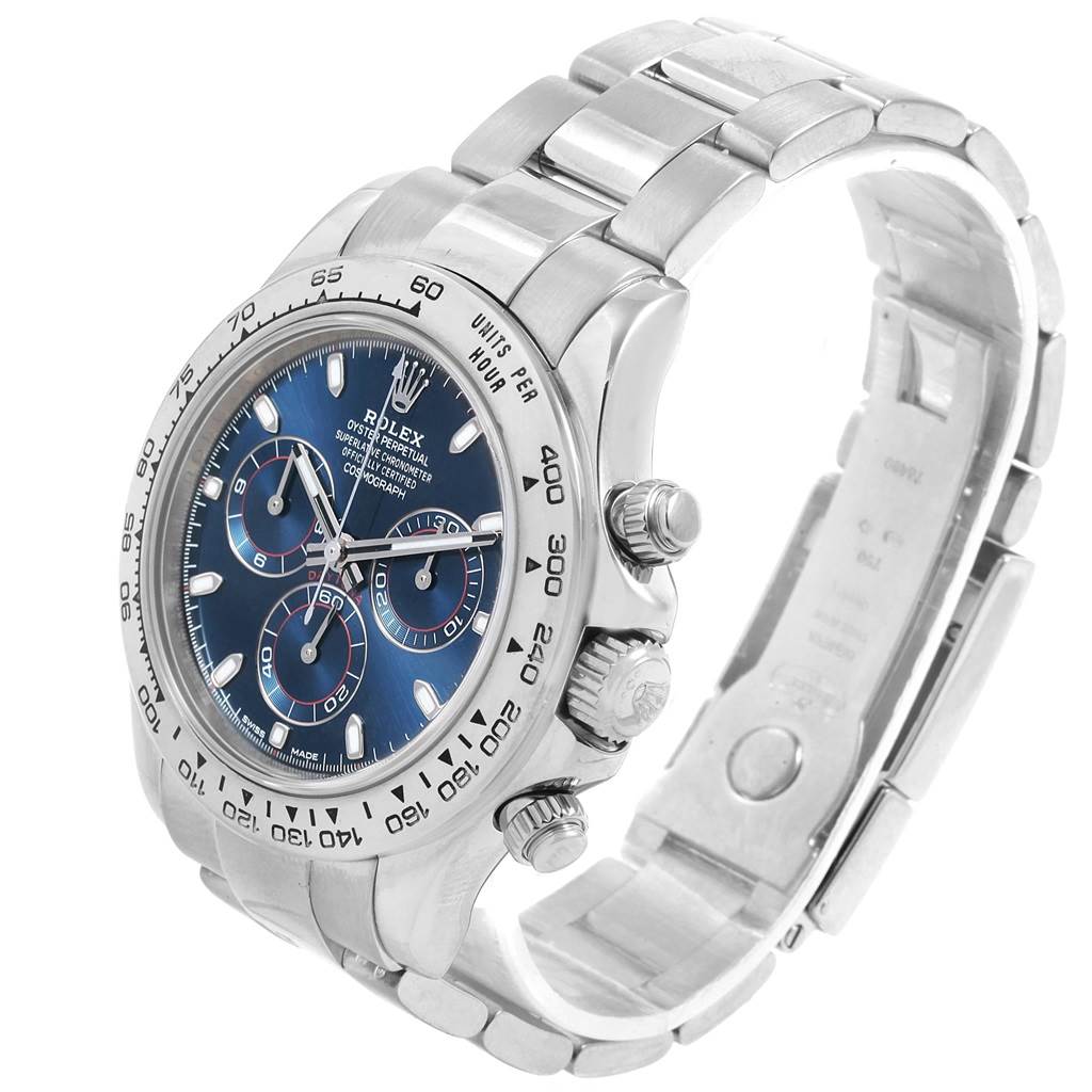 The image shows a side angle of a Rolex Daytona 116509 Men's White Gold Blue Dial 116509 Men's White Gold Blue Dial watch displaying its face, bezel, crown, pushers, and bracelet.