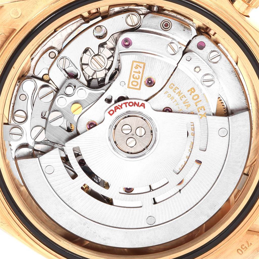 The image shows the movement mechanism of a Rolex Daytona 116518 Men's Yellow Gold Black Dial 116518 Men's Yellow Gold Black Dial watch, highlighting internal components and gears.