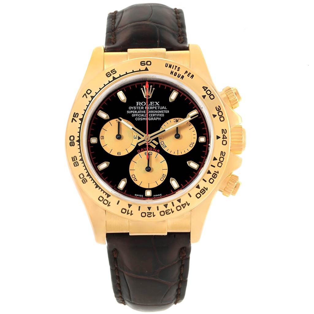 This Rolex Daytona 116518 Men's Yellow Gold Black Dial 116518 Men's Yellow Gold Black Dial watch is shown from a top-down angle, revealing its black dial, gold sub-dials, gold case, and brown leather strap.