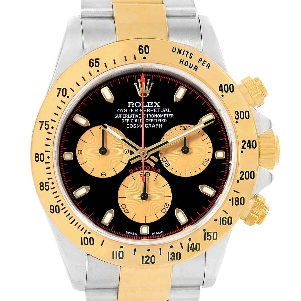 The Rolex Daytona 116523 Men's Steel and Gold (two tone) Black Dial 116523 Men's Steel and Gold (two tone) Black Dial watch is shown from a front angle, highlighting its black and gold dial, three sub-dials, and tachymeter bezel.