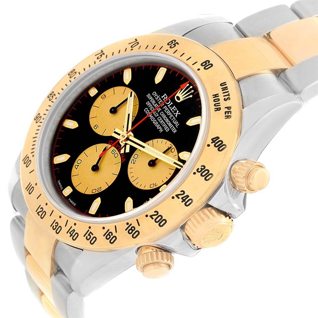 The image shows a side and front angle of a Rolex Daytona 116523 Men's Steel and Gold (two tone) Black Dial 116523 Men's Steel and Gold (two tone) Black Dial watch featuring its dial, bezel, and part of the bracelet.