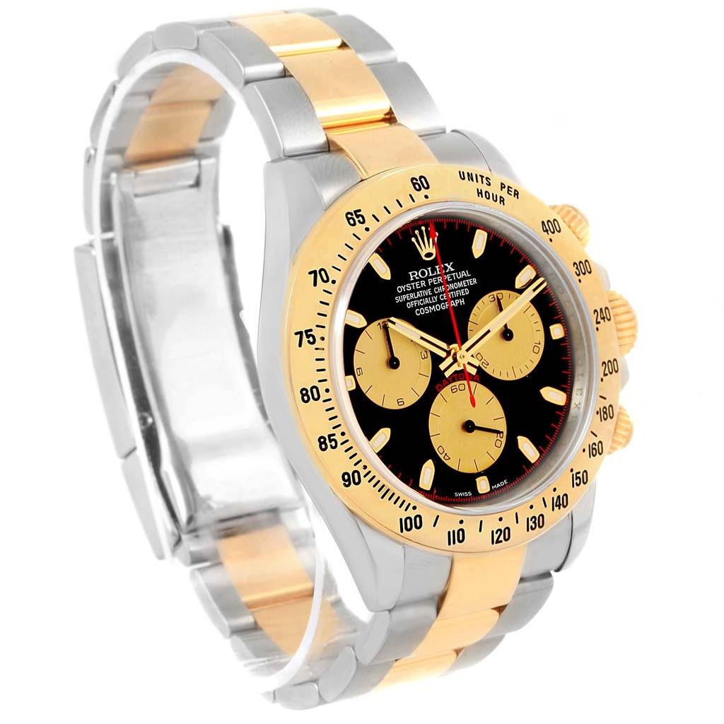 The Rolex Daytona 116523 Men's Steel and Gold (two tone) Black Dial 116523 Men's Steel and Gold (two tone) Black Dial watch is shown at an angled side view, highlighting its black and gold face, bezel, and two-tone bracelet.