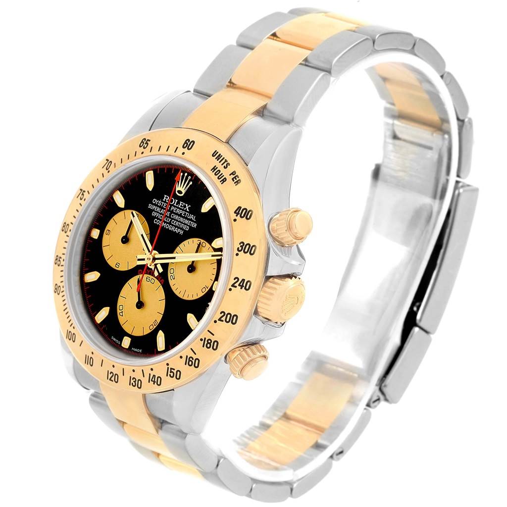 The Rolex Daytona 116523 Men's Steel and Gold (two tone) Black Dial 116523 Men's Steel and Gold (two tone) Black Dial watch is shown at an angled perspective, highlighting its bezel, dial, and two-tone bracelet.