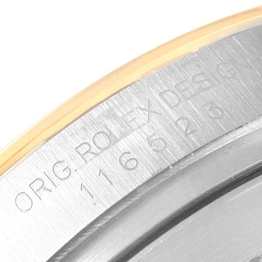 The image shows a close-up of the case side of a Rolex Daytona 116523 Men's Steel and Gold (two tone) Black Dial 116523 Men's Steel and Gold (two tone) Black Dial, highlighting the model's engraved reference number.