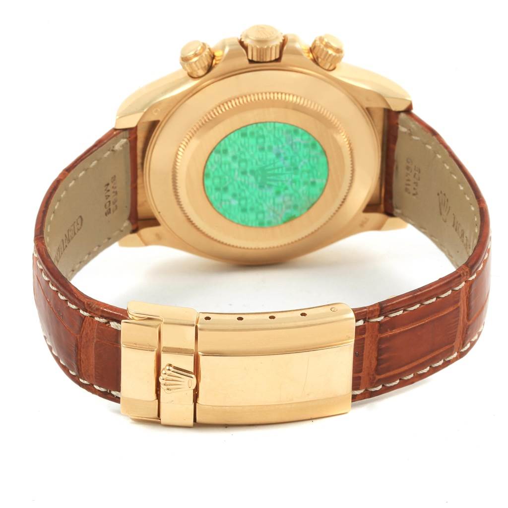 This image shows the back, clasp, and part of the strap of a Rolex Daytona 116518 Men's Yellow Gold Mother of Pearl Dial 116518 Men's Yellow Gold Mother of Pearl Dial watch.