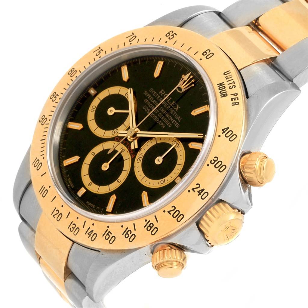 This Rolex Daytona 16523 Men's Steel and Gold (two tone) Black Dial 16523 Men's Steel and Gold (two tone) Black Dial watch is shown at an angle, highlighting its gold-tone bezel, chronograph dials, and side buttons.