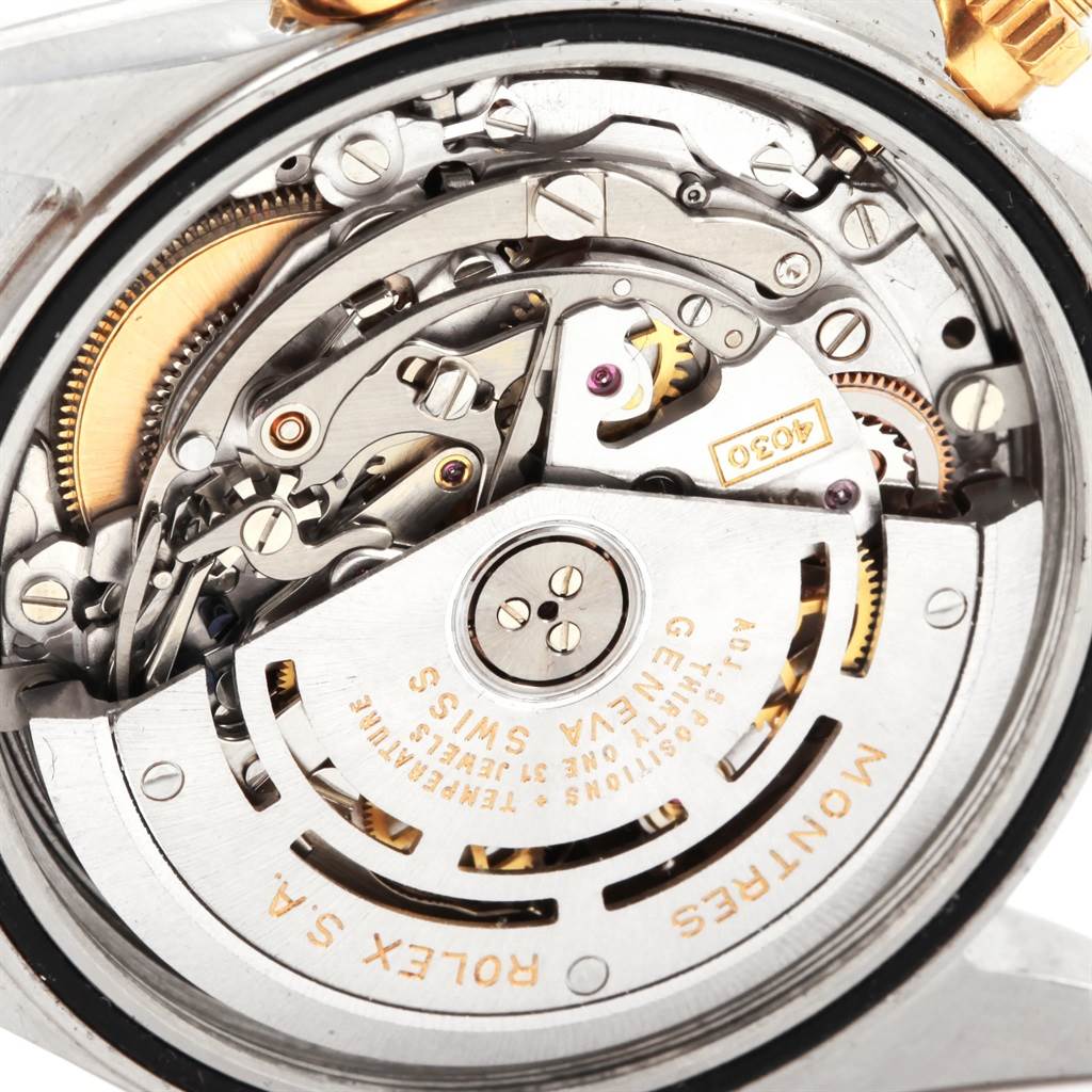 This image shows a close-up of the inner mechanism and movement parts of a Rolex Daytona 16523 Men's Steel and Gold (two tone) Black Dial 16523 Men's Steel and Gold (two tone) Black Dial watch.