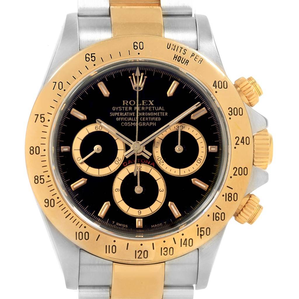 This image shows a close-up of the Rolex Daytona 16523 Men's Steel and Gold (two tone) Black Dial 16523 Men's Steel and Gold (two tone) Black Dial watch face, bezel, and crown, viewed from the front.