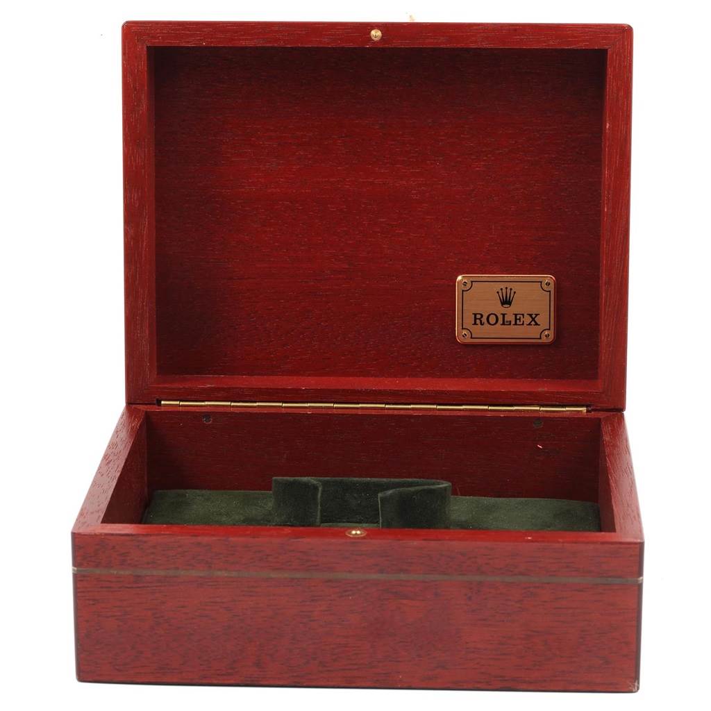 This image shows an open wooden box labeled "Rolex," likely used for storing a Daytona model watch by Rolex.