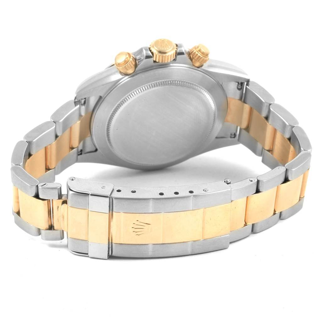 The image shows the back case and bracelet of a Rolex Daytona 16523 Men's Steel and Gold (two tone) Black Dial 16523 Men's Steel and Gold (two tone) Black Dial watch, featuring a two-tone metal design.