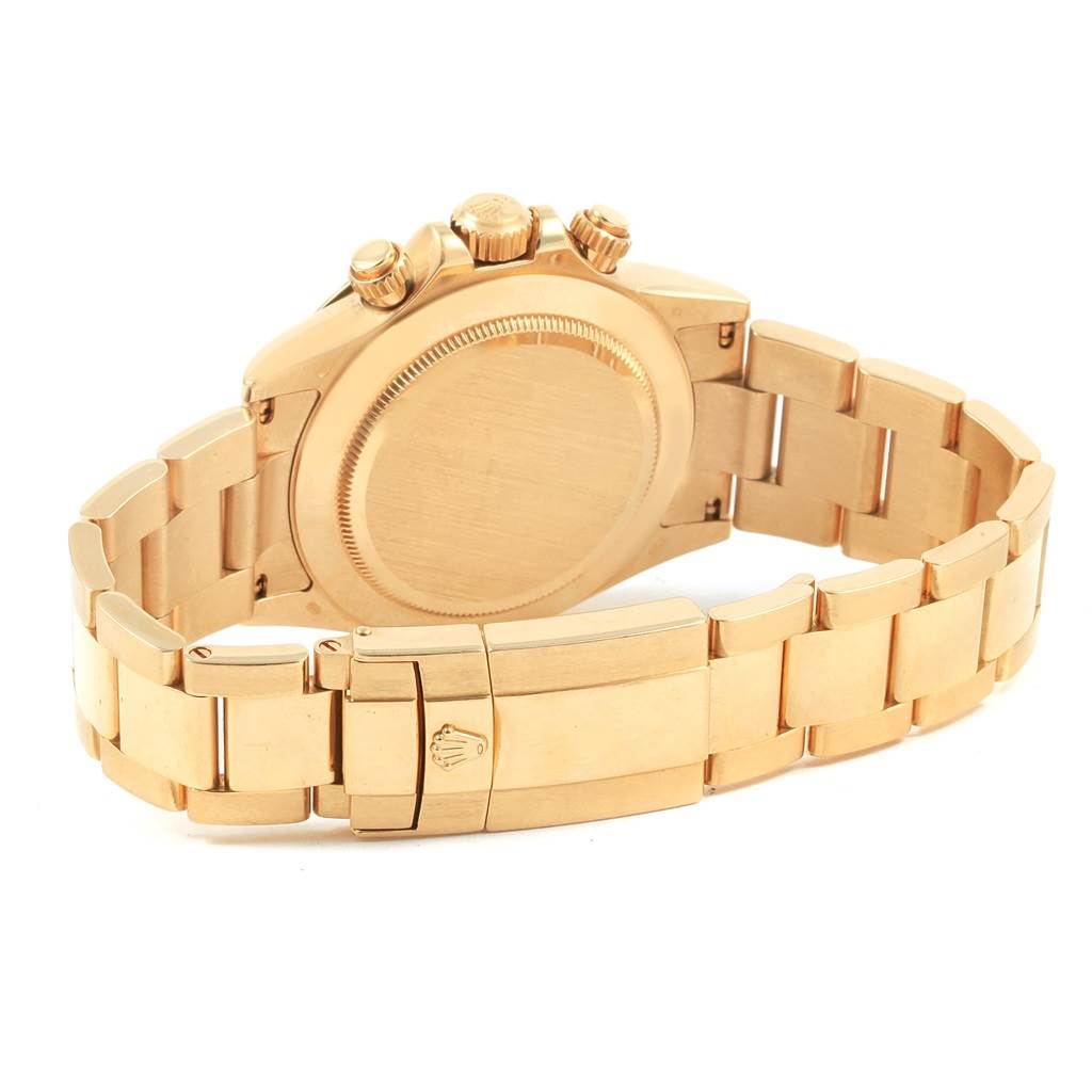 The image shows the backside and bracelet of a Rolex Daytona 116528 Men's Yellow Gold Champagne Dial 116528 Men's Yellow Gold Champagne Dial watch, including the clasp and the case back.