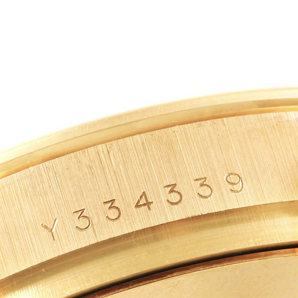 The image shows a close-up of the serial number engraving on the case of a Rolex Daytona 116528 Men's Yellow Gold Champagne Dial 116528 Men's Yellow Gold Champagne Dial watch.