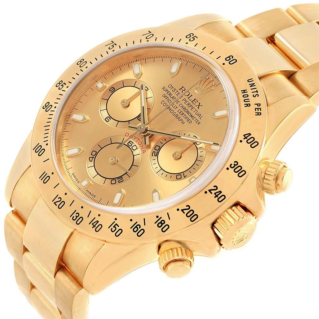 This image shows a Rolex Daytona 116528 Men's Yellow Gold Champagne Dial 116528 Men's Yellow Gold Champagne Dial watch from a three-quarter angle, highlighting the dial, bezel, pushers, and band.