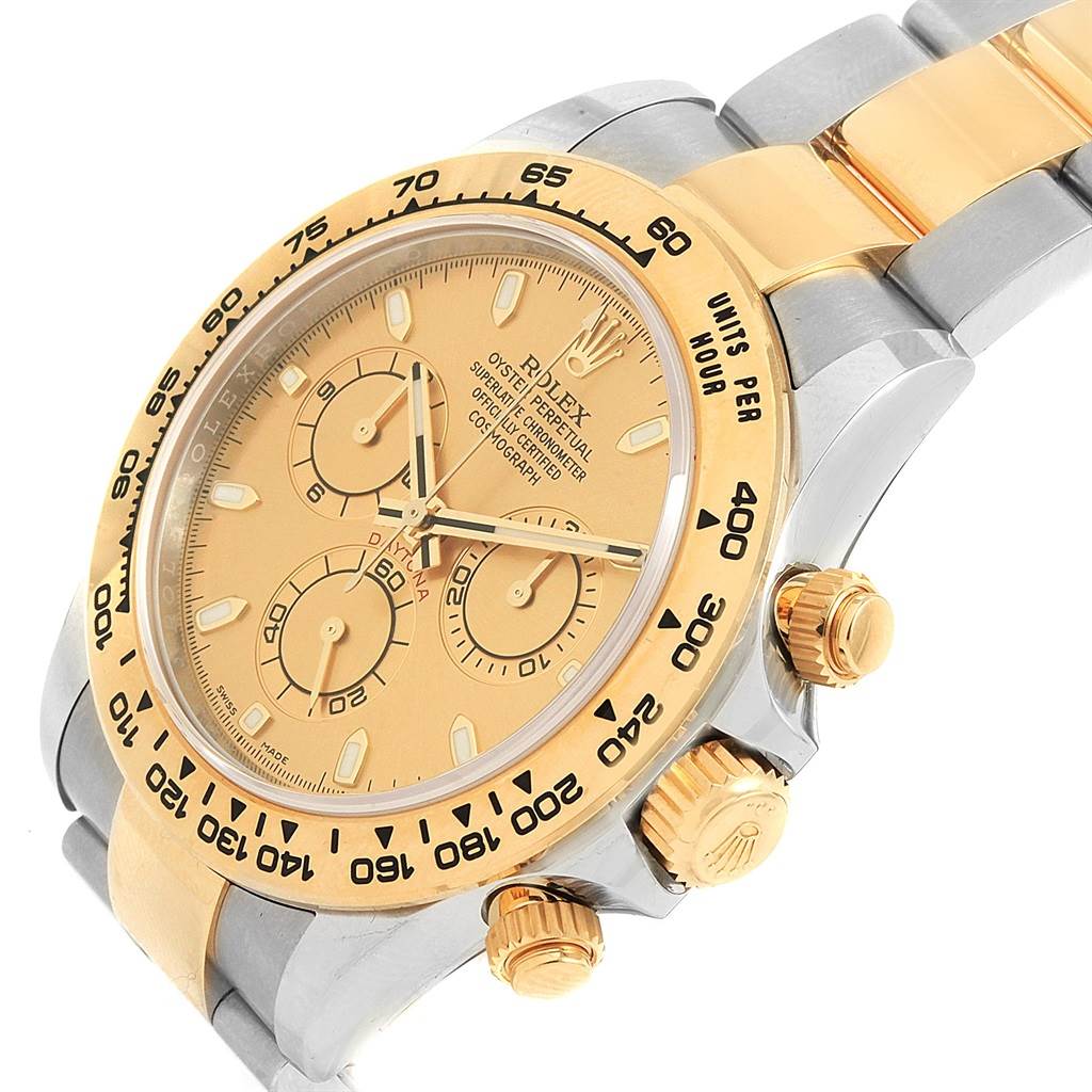 The image shows a close-up angle of a Rolex Daytona 116503 Men's Steel and Gold (two tone) Champagne Dial 116503 Men's Steel and Gold (two tone) Champagne Dial watch, highlighting its dial, bezel, and crown with pushers.