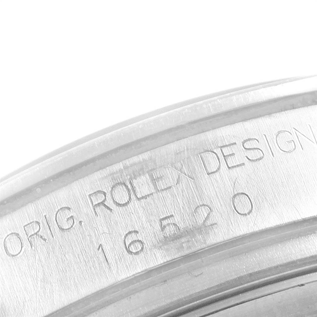 This image shows a close-up of the case back of a Rolex Daytona 16520 Men's Stainless Steel Black Dial 16520 Men's Stainless Steel Black Dial model, featuring engraved text.