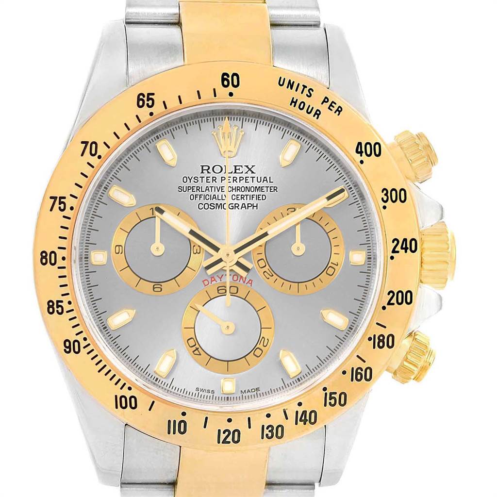 This image shows a Rolex Daytona 116523 Men's Steel and Gold (two tone) Grey Dial 116523 Men's Steel and Gold (two tone) Grey Dial watch face from a front angle, highlighting its bezel, subdials, hands, and markers.