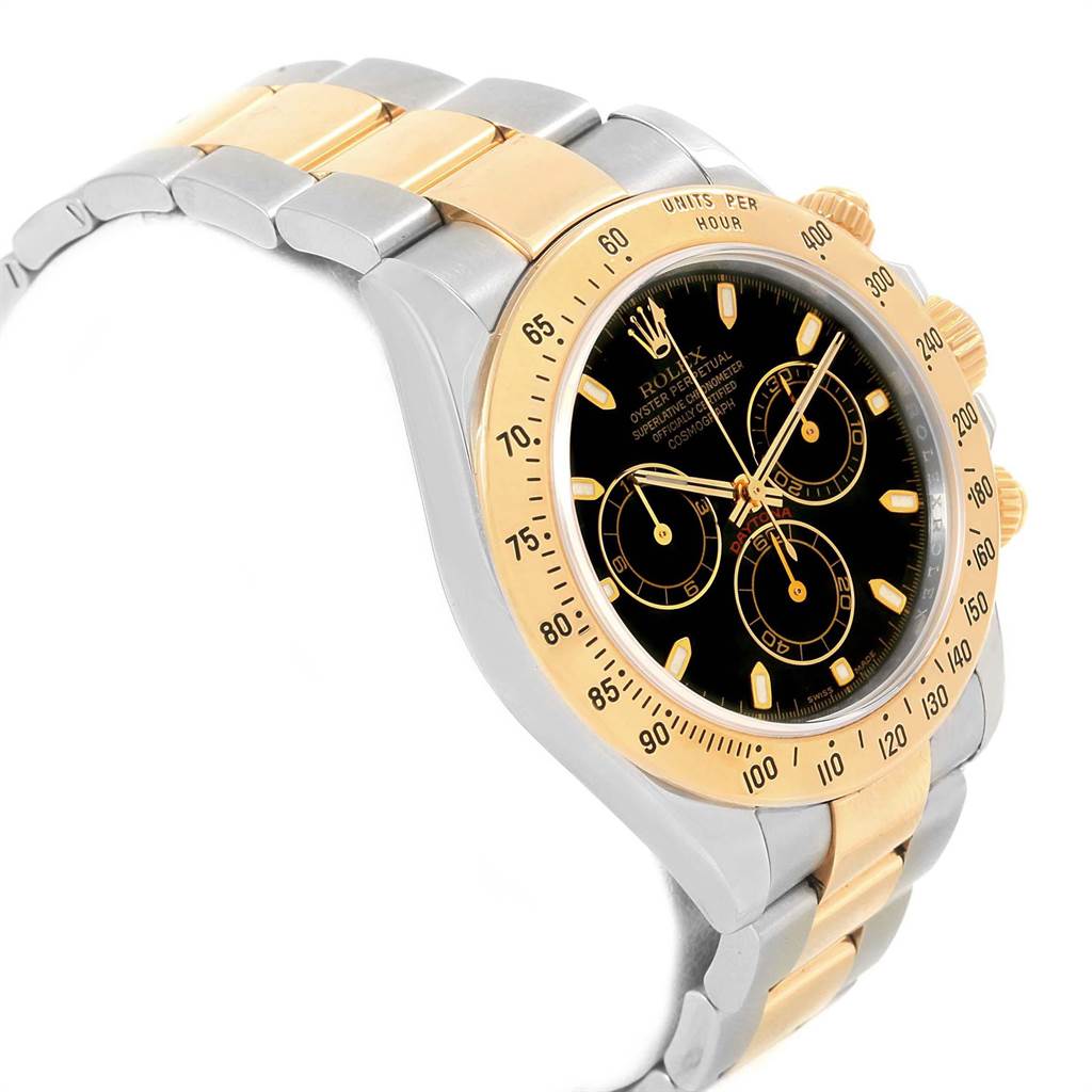 The image shows a Rolex Daytona 116523 Men's Steel and Gold (two tone) Black Dial 116523 Men's Steel and Gold (two tone) Black Dial watch at a three-quarter angle, featuring the face, bezel, push buttons, and a two-tone metal bracelet.