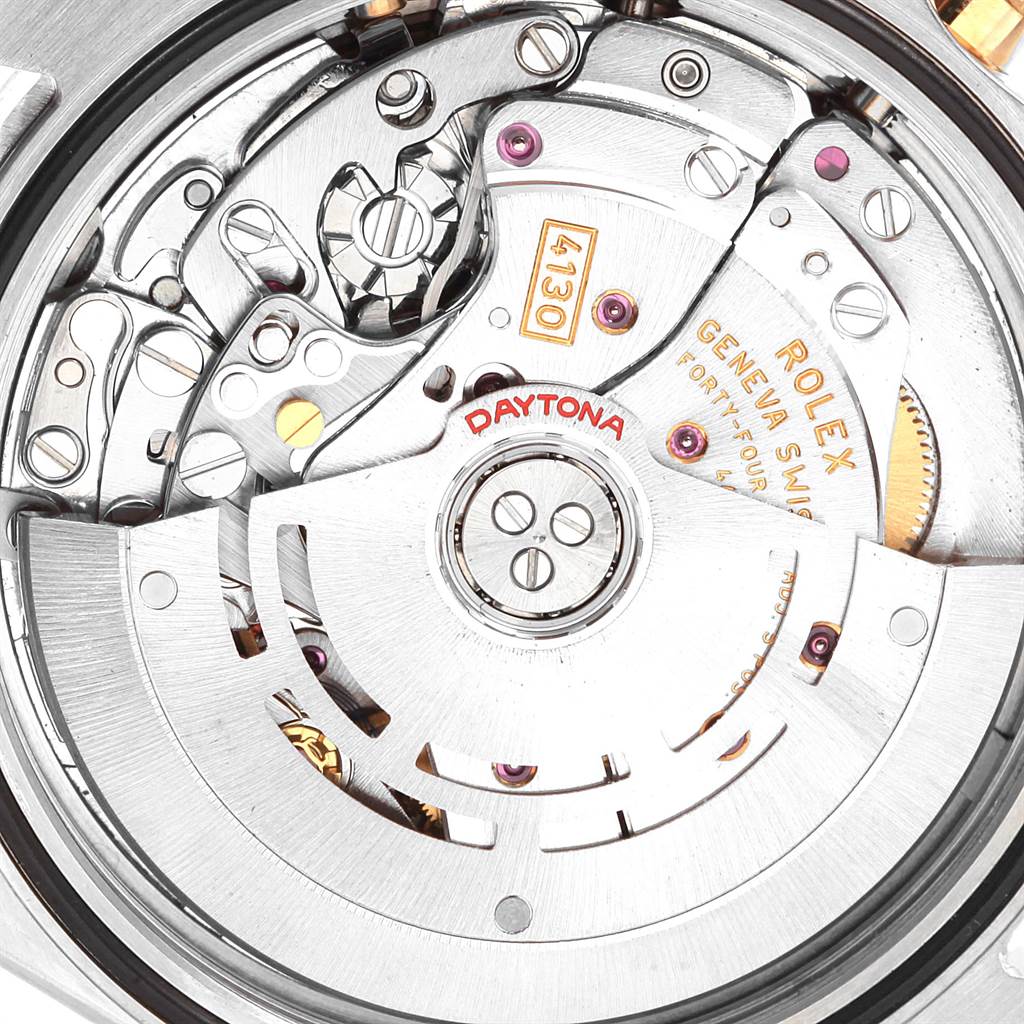 This image shows a close-up of the movement mechanism of a Rolex Daytona 116523 Men's Steel and Gold (two tone) Black Dial 116523 Men's Steel and Gold (two tone) Black Dial watch.