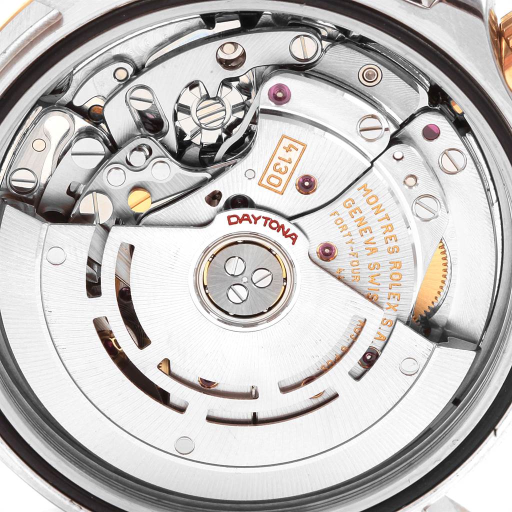 This image shows the inner mechanics and movement of the Rolex Daytona 116523 Men's Steel and Gold (two tone) Black Dial 116523 Men's Steel and Gold (two tone) Black Dial watch from a rear, close-up angle.
