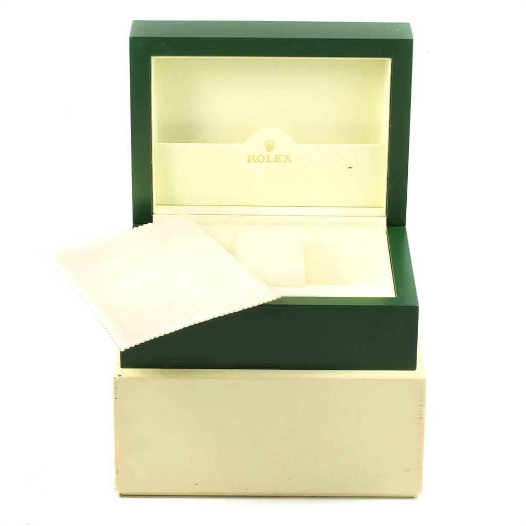 This image displays a Rolex Daytona 116520 Men's Stainless Steel Black Dial 116520 Men's Stainless Steel Black Dial watch box in an open position, featuring its green exterior and cream interior.