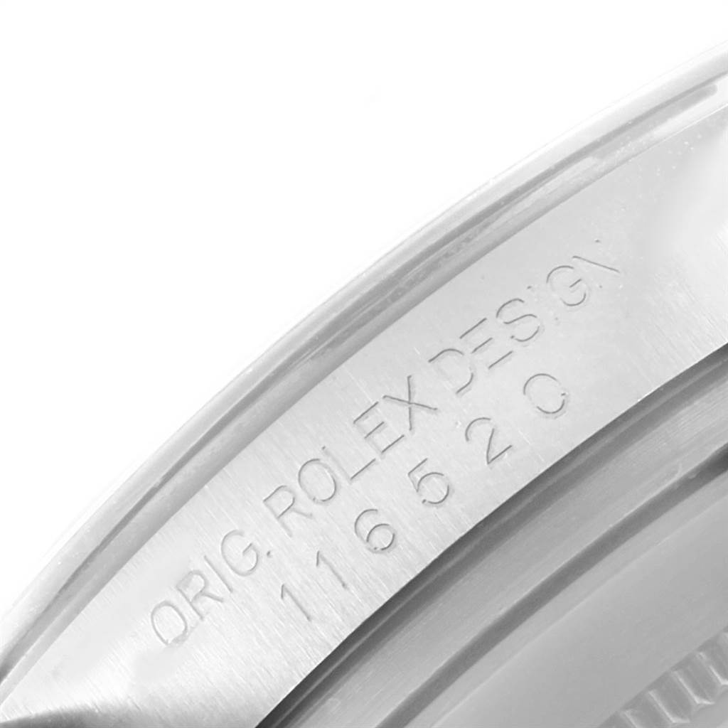 This image shows a close-up of the inner bezel with the engraving "ORIG. ROLEX DESIGN 116520" on a Rolex Daytona 116520 Men
s Stainless Steel Black Dial 116520 Men
s Stainless Steel Black Dial watch.