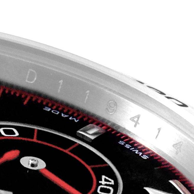 The image shows a close-up of the bezel and part of the dial of a Rolex Daytona 116509 Men's White Gold Black Dial 116509 Men's White Gold Black Dial watch.
