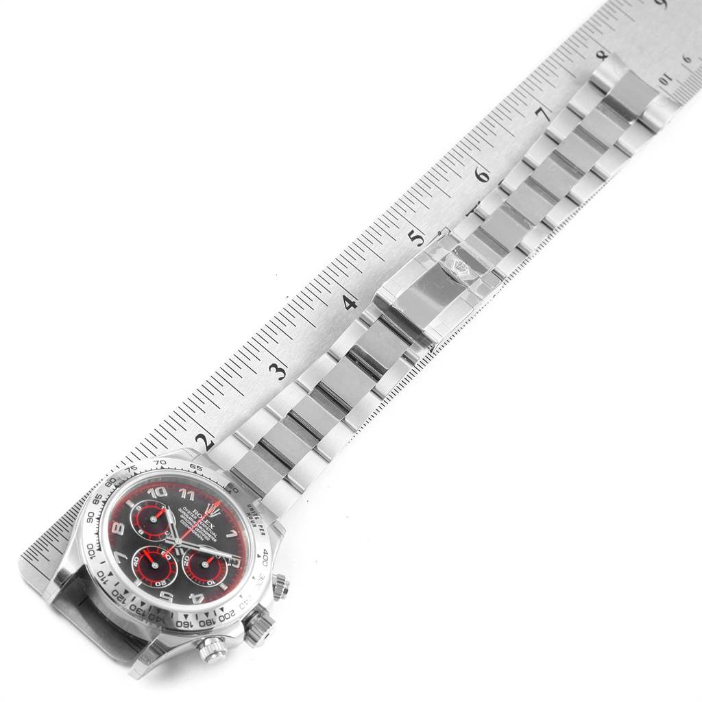 The image shows a top-down view of a Rolex Daytona 116509 Men's White Gold Black Dial 116509 Men's White Gold Black Dial watch with a ruler next to the watch and bracelet for size reference.