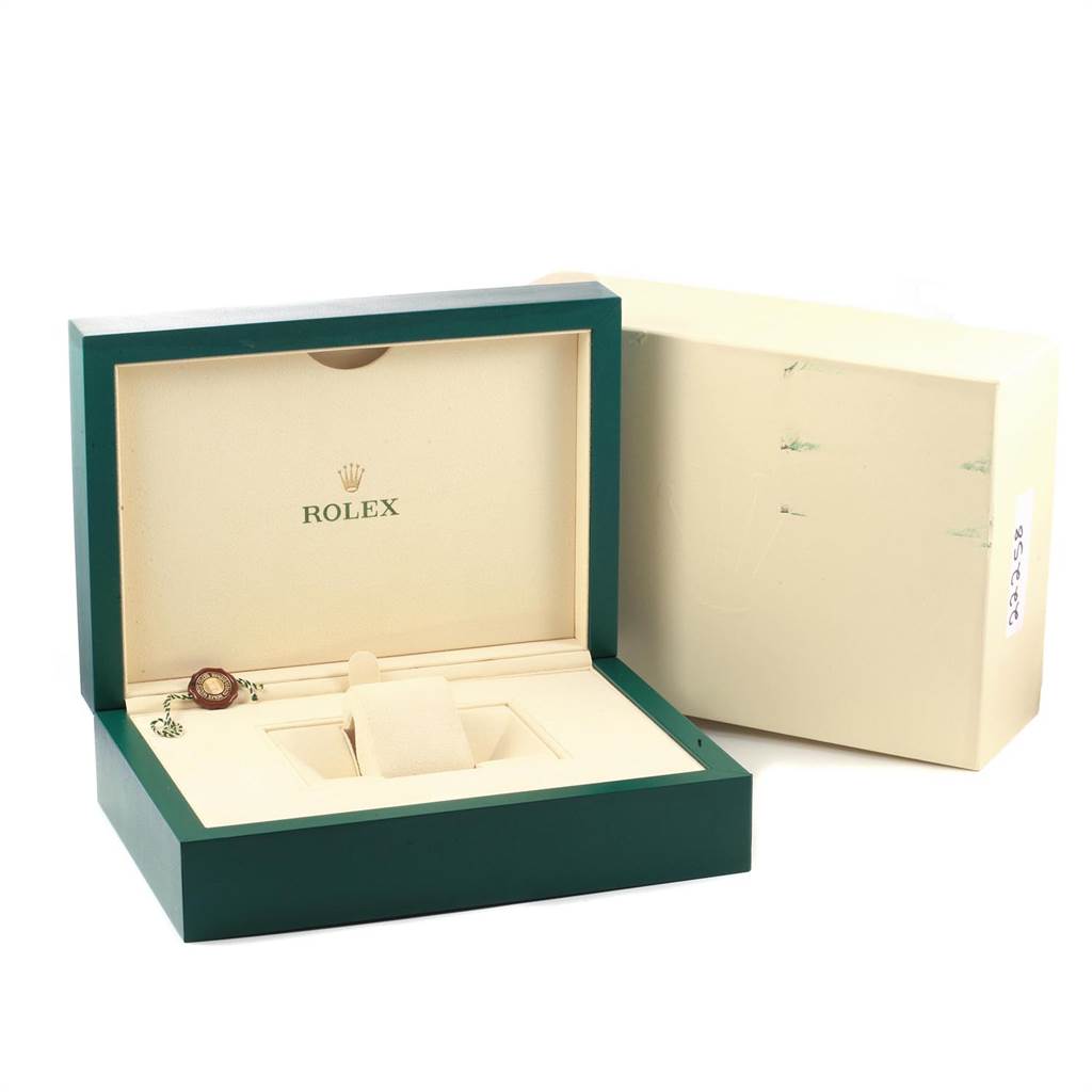 The image shows an open Rolex Daytona 116509 Men's White Gold Black Dial 116509 Men's White Gold Black Dial watch box, including a cushion for the watch and a warranty tag, from a front angle.