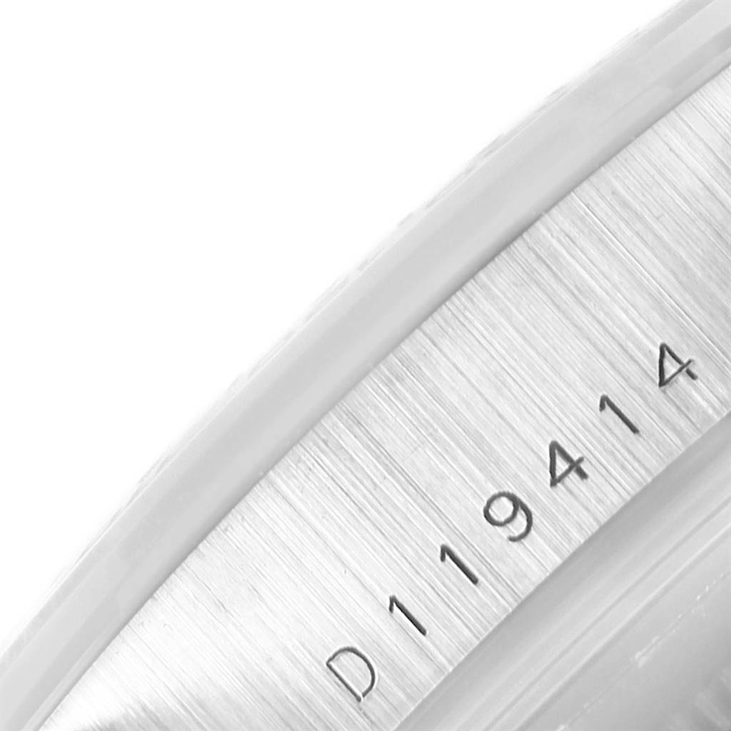 This close-up image shows the serial number engraved on the inner bezel of a Rolex Daytona 116509 Men's White Gold Black Dial 116509 Men's White Gold Black Dial watch.