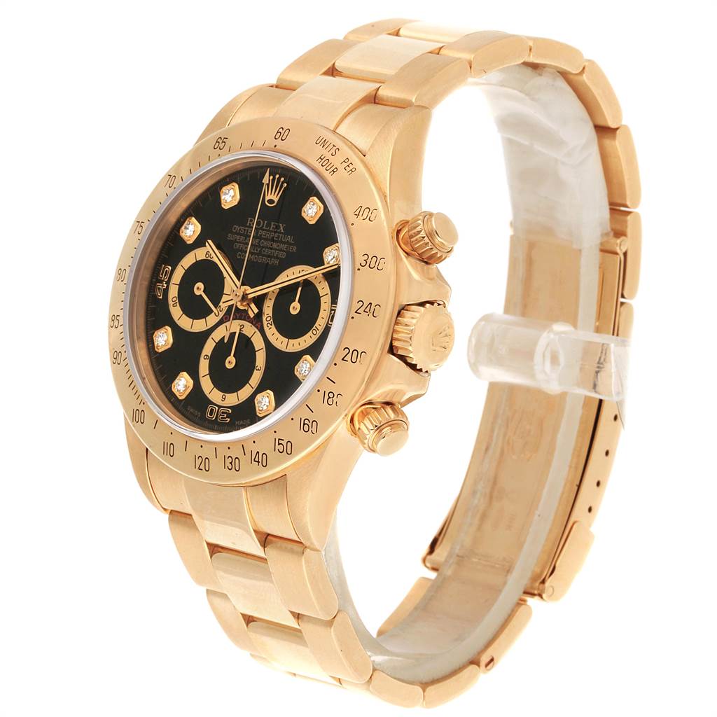 This is a side angle view of the Rolex Daytona 16528 Men's Yellow Gold Black Dial 16528 Men's Yellow Gold Black Dial watch, showcasing the dial, bezel, crown, and part of the bracelet.