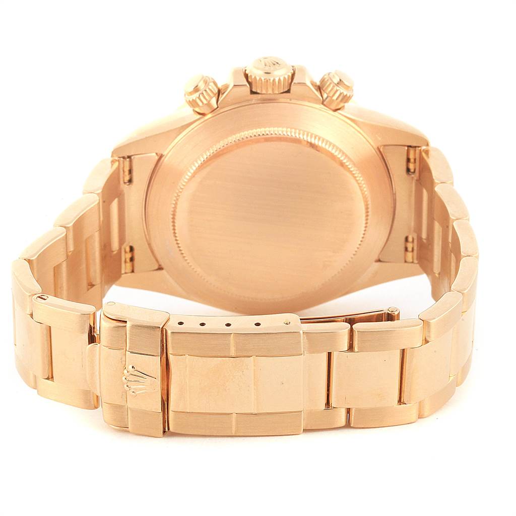 The image shows the back view of a Rolex Daytona 16528 Men's Yellow Gold Black Dial 16528 Men's Yellow Gold Black Dial watch, highlighting the case, the bracelet, and the clasp with the Rolex logo.