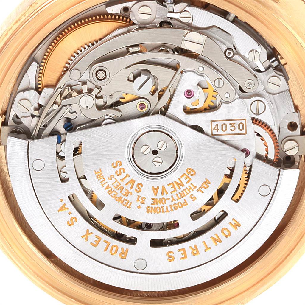 This image displays the intricate movement mechanism of a Rolex Daytona 16528 Men's Yellow Gold Black Dial 16528 Men's Yellow Gold Black Dial watch, viewed from the case back angle.