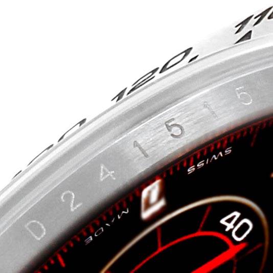 The image shows a close-up of the bezel and part of the dial of a Rolex Daytona 116509 Men's White Gold Black Dial 116509 Men's White Gold Black Dial watch, focusing on its markings and numbers.