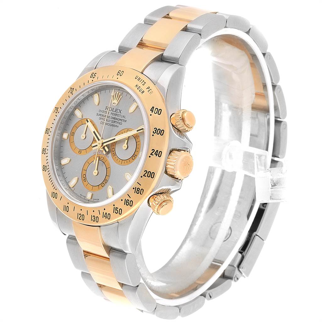 This image shows a side angle of the Rolex Daytona 116523 Men's Steel and Gold (two tone) Grey Dial 116523 Men's Steel and Gold (two tone) Grey Dial watch displaying the face, bezel, crown, and part of the bracelet.